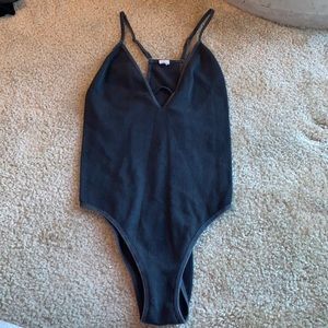 spandex material black body suit purchased from boutique